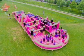 Pink inflatable trampoline, obstacle course